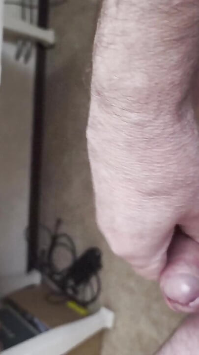 My Friend Sits in a Chair and Jerks His Cock While Watching the Video Until He Orgasms