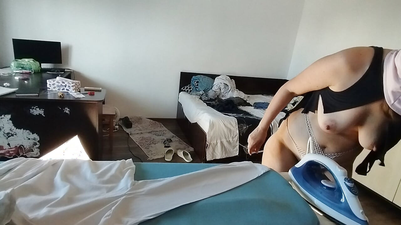 Sexy wife doing housework naked. Brunette, hairy pussy, big ass, big tits. Sexy mom massages herself with a vibrator.