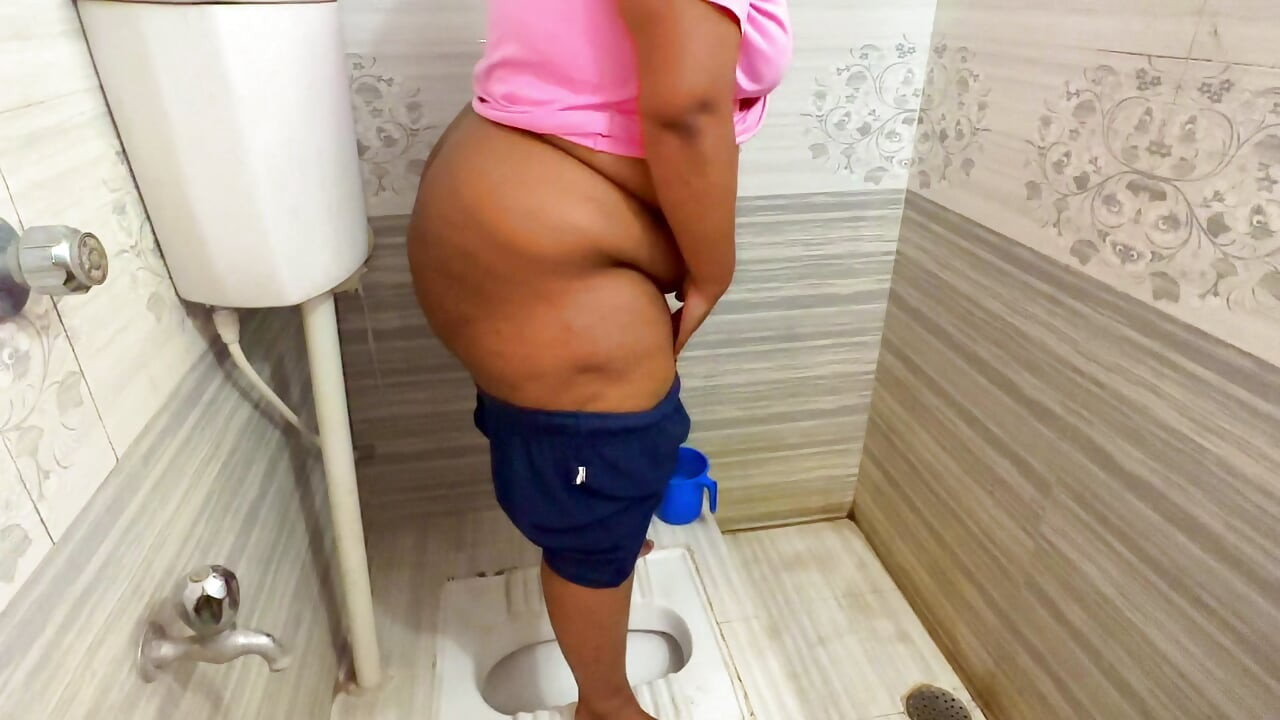 Indian Desi Mother-in-law While Peeing in the Bathroom