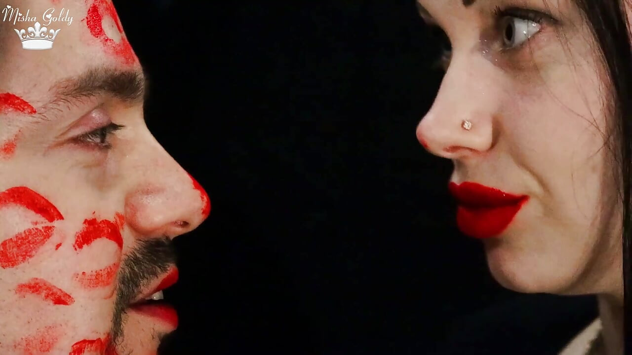Covering Alex face with red lipsticks kisses