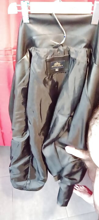 Ejaculating on the lining of her black leather coat