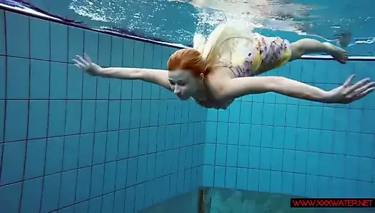 Blonde in a dress in a pool