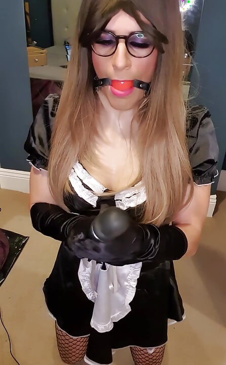 Being a good little sissy maid, all dressed up in her black satin French maid dress, fishnet stockings, 6 strap suspenders
