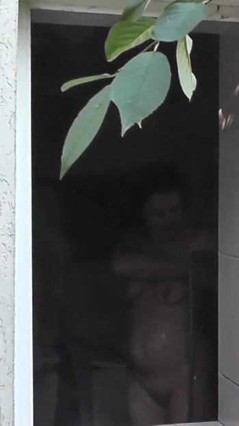 Powerful moment from "Outside - young neighbor watches Milf taking Shower"