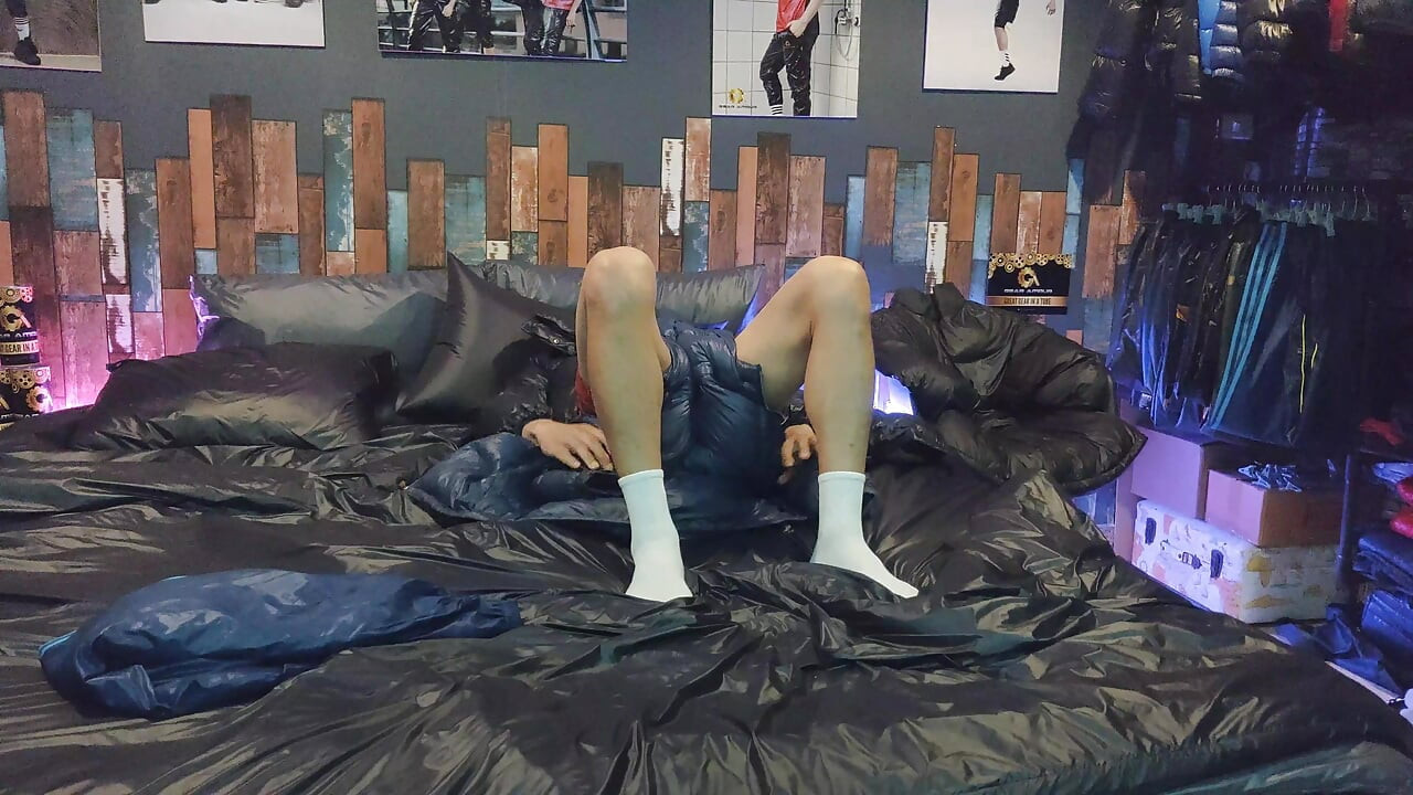 Cock Rubbing Down Jacket on Shiny Nylon Bed