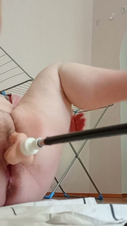Mother-in-law with big hairy pussy gets a big squirt from a sex machine | Clip 1