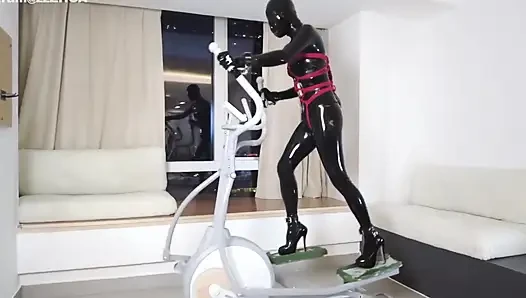 Mz27 - a Girl Bound in Latex Walks on a Treadmill