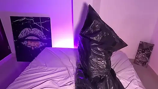 Girl in Garbage Bag Plays with Her Breath