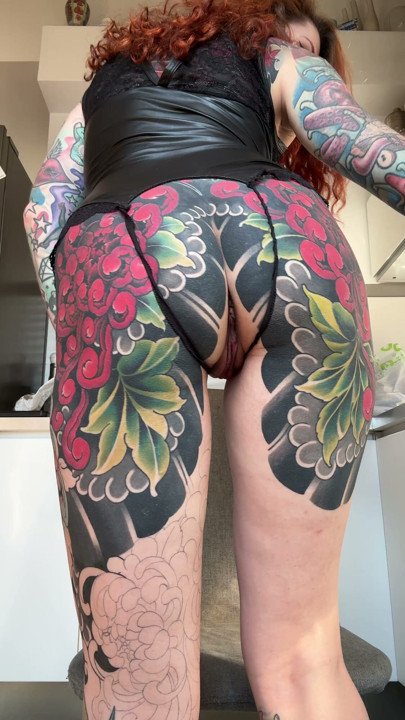 Tattooed ass, spread wide