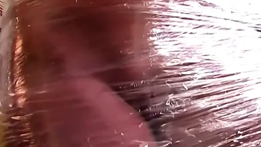 Plastic Wrapped Slut Gaping Wide Through Shiny Film