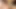 Curly-haired ladyboy in black bra pulls out a small dick