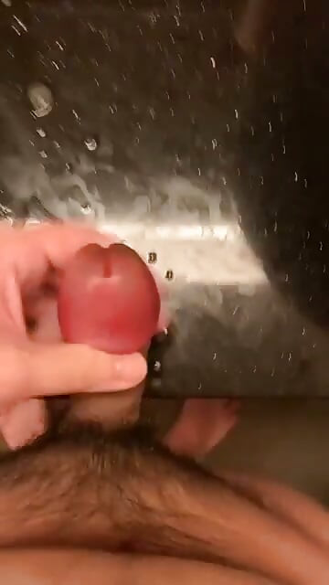 rubbing my big swollen cock head until i sprayed all over the table