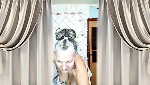 The cheerful housewife Lukerya. Noble silver hair and a cozy light.