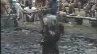 Nude ladies mud wrestle