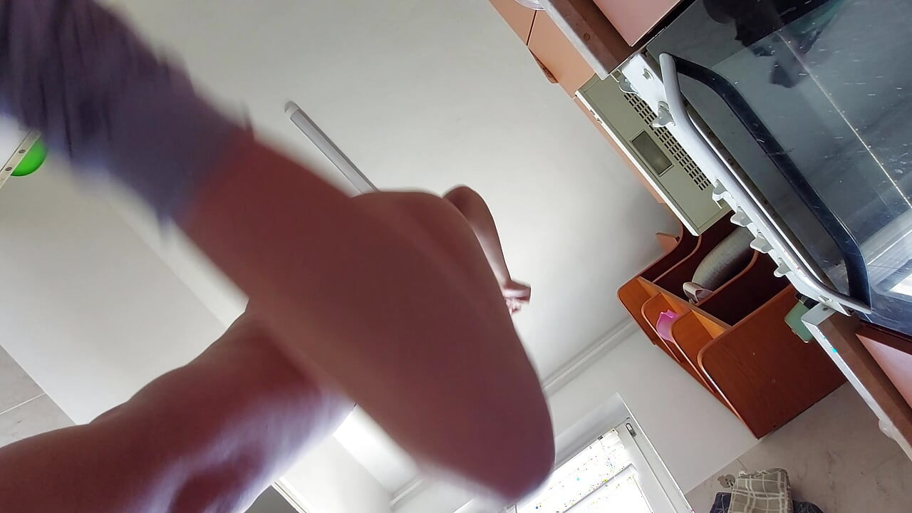 Sexy wife prepares breakfast naked in the kitchen.