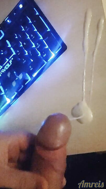 Gamer in the night. Cum on table.