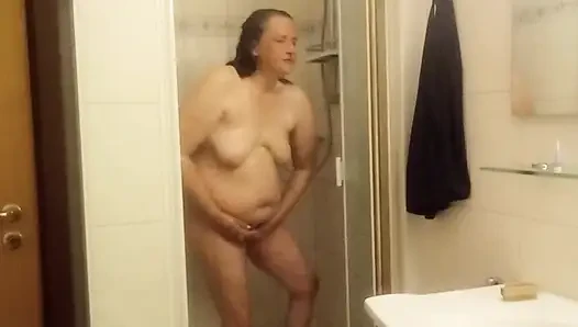 Mature chubby woman in the shower  big belly can be seen well