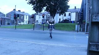 Crossdressed in maid uniform on a street with passing cars