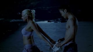 Chinese man and white girl on the beach (2007)