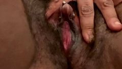 Ebony chick playing with her huge pierced clit