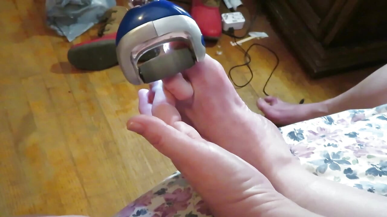 Nurse Vicki grinds her toe nails down with her electric Pedi egg tool ! Poor ugly toes need it real bad!