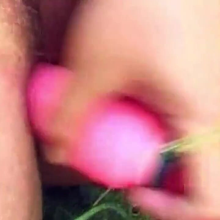 Brunette Toys Herself with Pink Dildo in Woods
