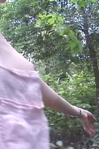 Sexy redhead streaks naked in a park