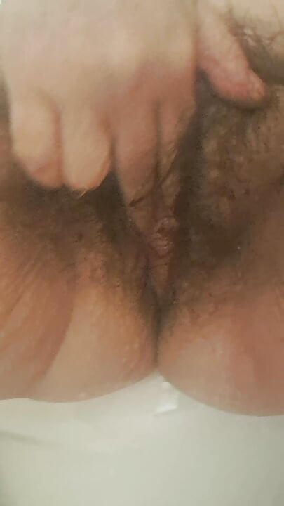 MILF in heat sucking her fingers from vaginal wetness