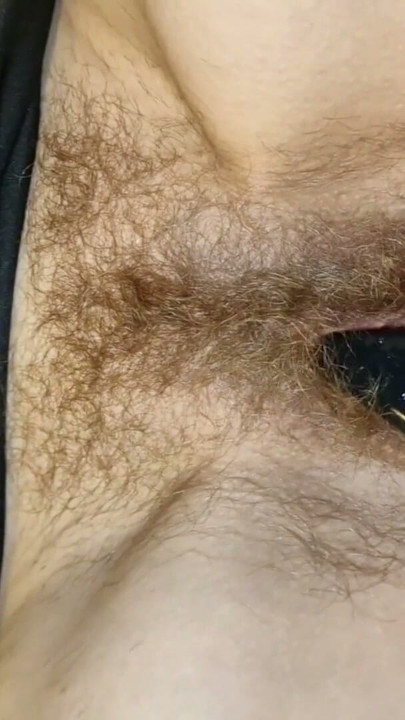 The juice begins to pour out of her hairy pussy | Clip 1