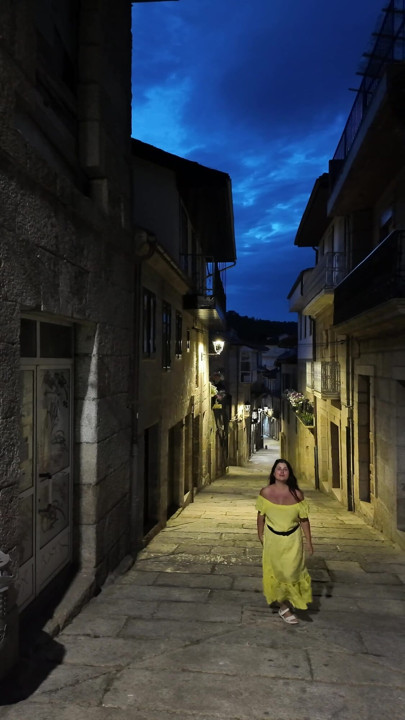 Hot milf shows off her breasts on a Spanish street.