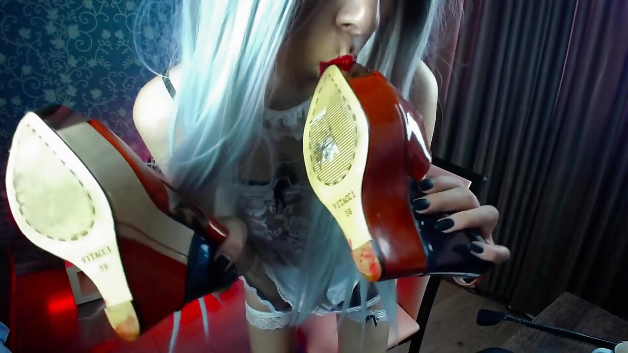 Feet in heels and licking heels