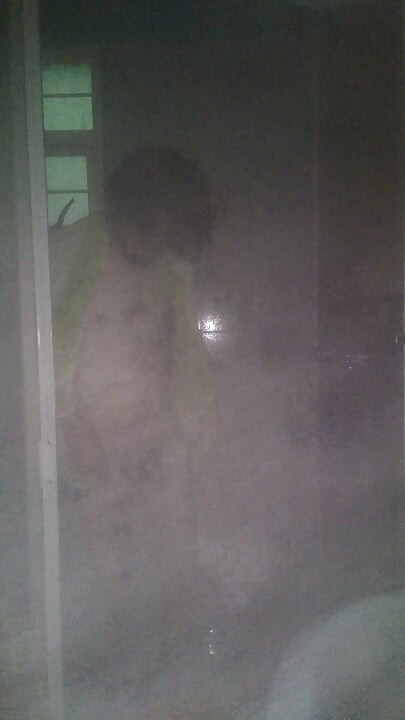 Man Showering with Flashlight On