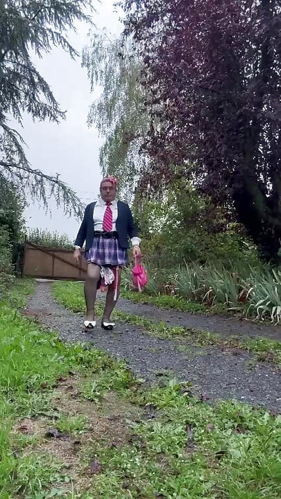 Dressed in a little pink plaid skirt for a party