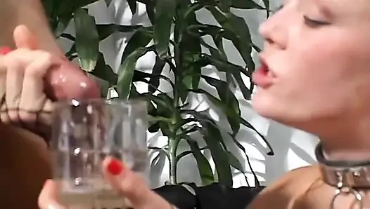 Kinky redhead drinks cumload from a glass after getting double penetrated