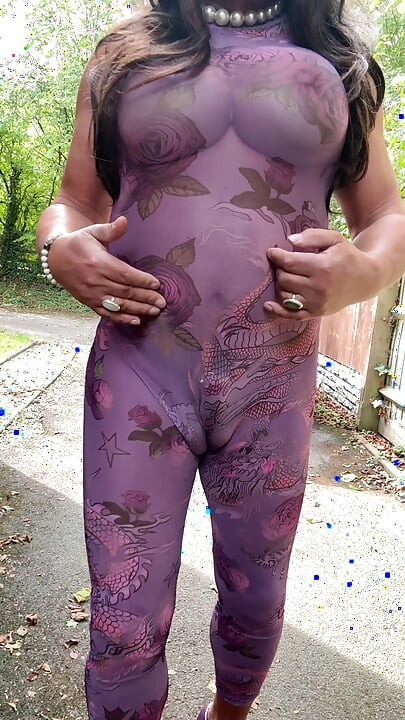 Sexy Crossdresser kellycd2022 in purple catsuit and heels outdoors