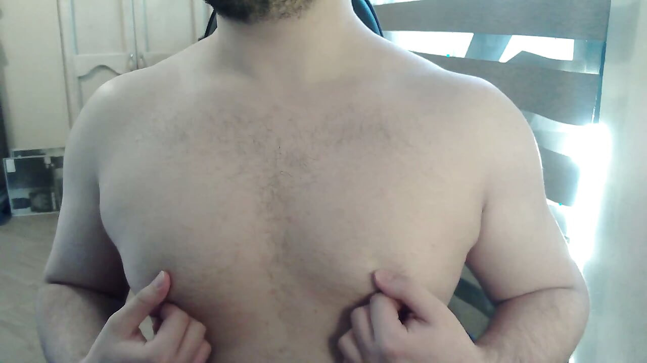 Muscular stud plays with his nipples and muscles