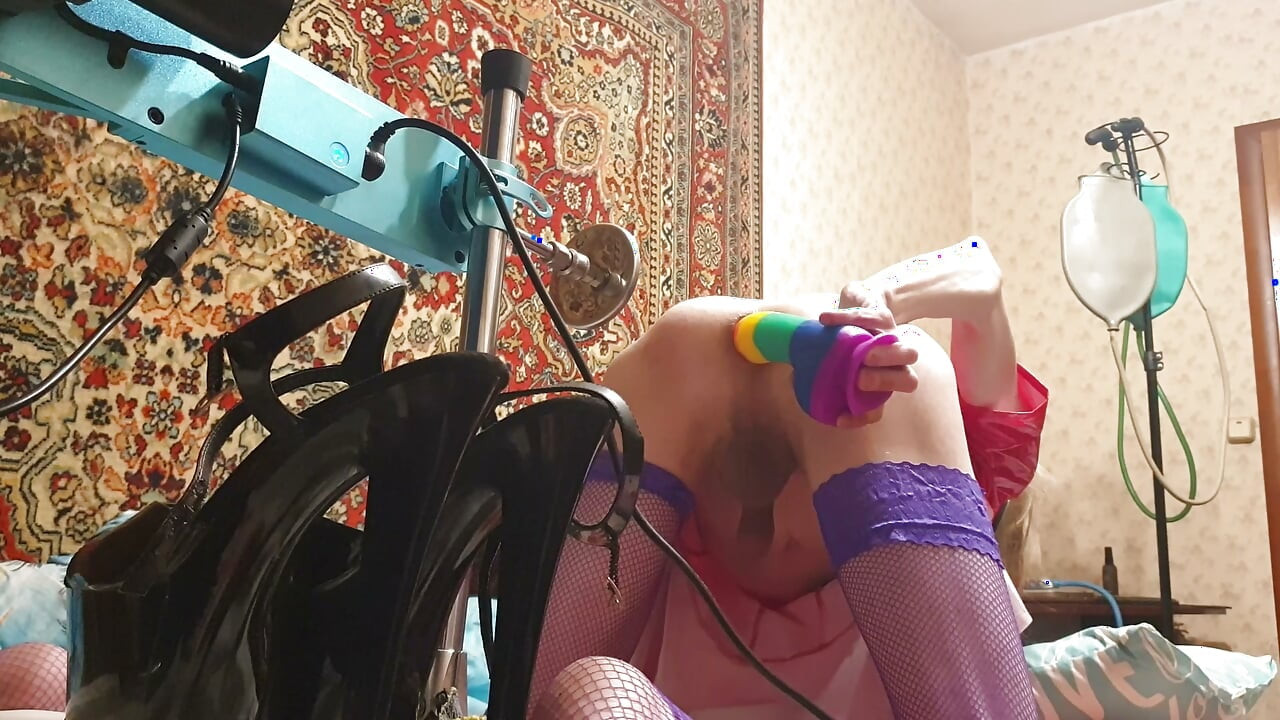 Sissy having deep anal sex with a fuck machine rainbow dildo