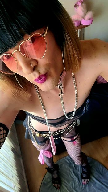 Sissy on a pink leash shows off at the Balcony
