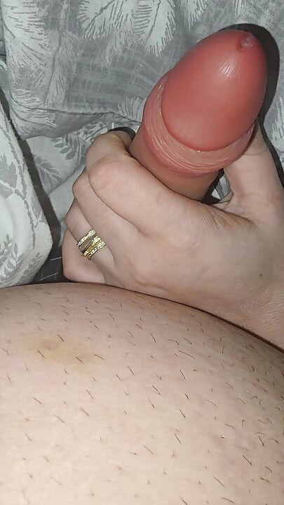 Step sister surprises step brother with a handjob while they watch a movie
