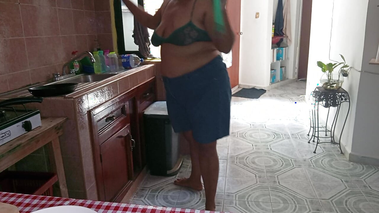Mom in the kitchen in bralett