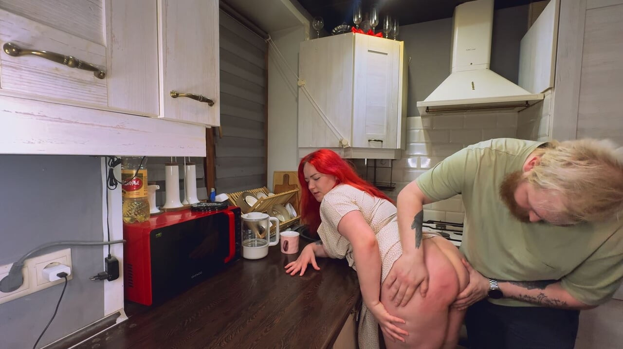 Sex in the kitchen with a red-haired wife. .
