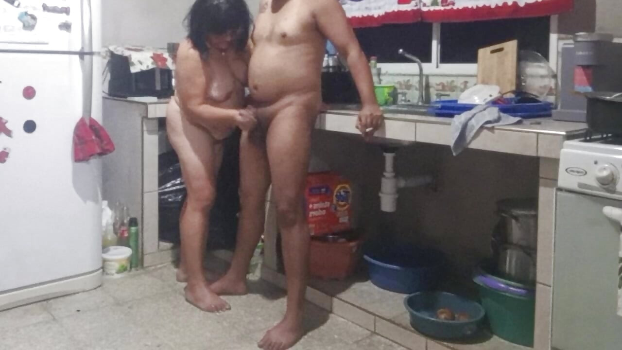 My mother-in-law masturbates me in the kitchen and wants me to fuck her doggy style.