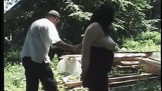 Mature brunette with big tits fucks outdoors