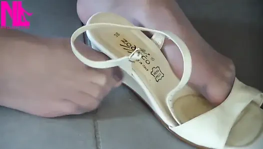 Nyllady Putting on Pantyhose and Footplay with Milk Colored Wedges