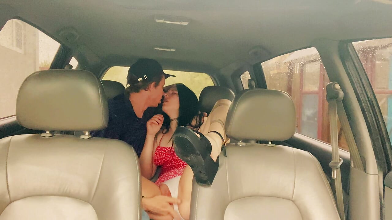 Wife cheating with a taxi driver in the car outside the house