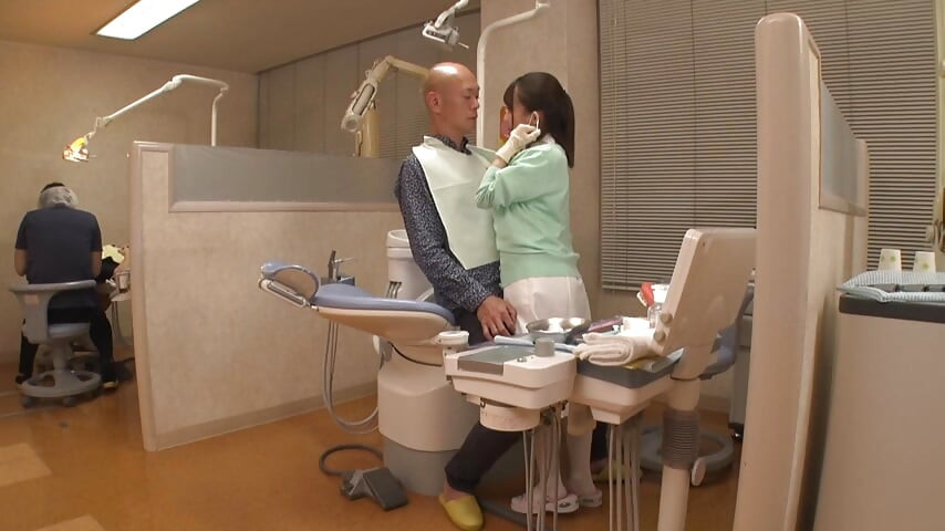 Elegant Dental Hygienist Leaning Close