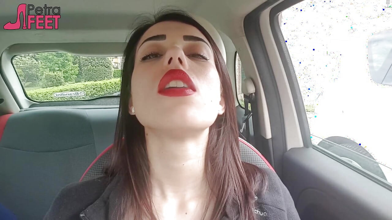 Good looking Petra smoking in her car