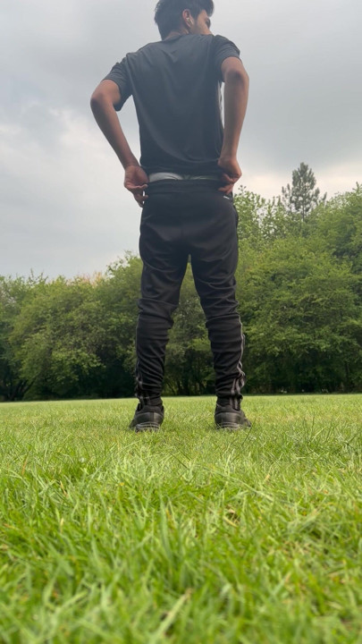 A twink boy showing dick in park