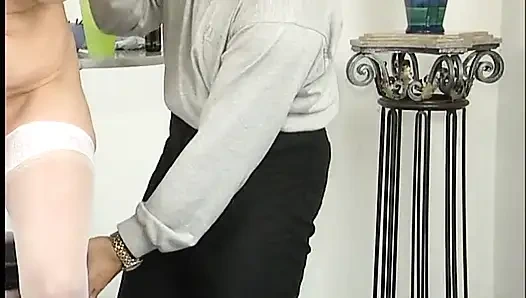 MILF sucks a huge dildo then sits on it having it deep in her pussy