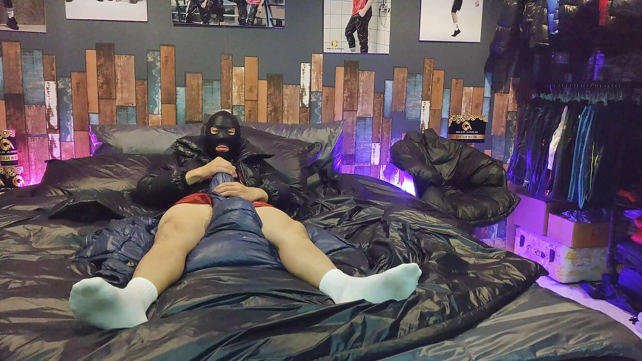 Cock Rubbing Down Jacket on Shiny Nylon Bed